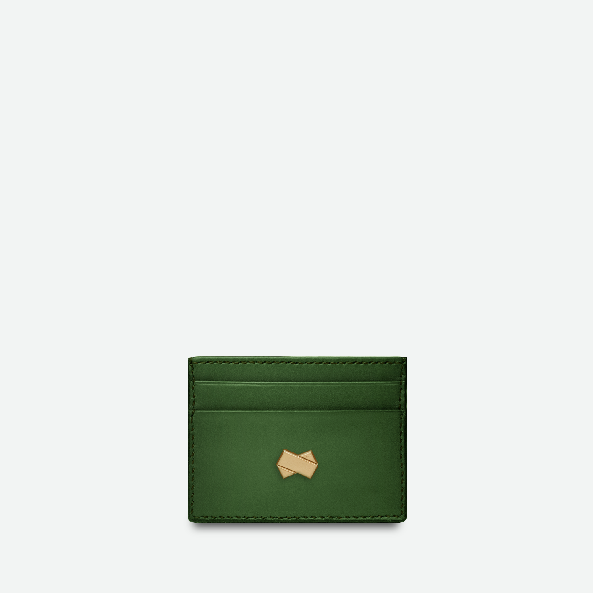 Grøn læder kortholder til kvinder med gyldent Faubret-logo. Raffineret design og håndlavet kvalitet.